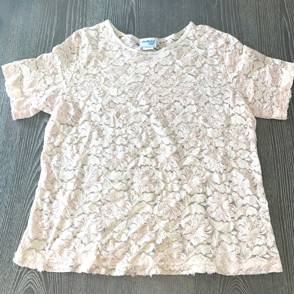 Light pink or cream color shirt, a see threw Shirt